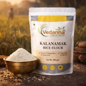 Vedanna Kalanamak Rice Flour 500g in farm setting with brass bowl gluten free GI tagged rice flour India